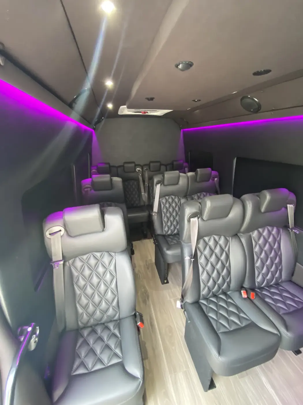 Executive Sprinter quilted seats beside the center aisle — Hourly Sprinter Van Charter