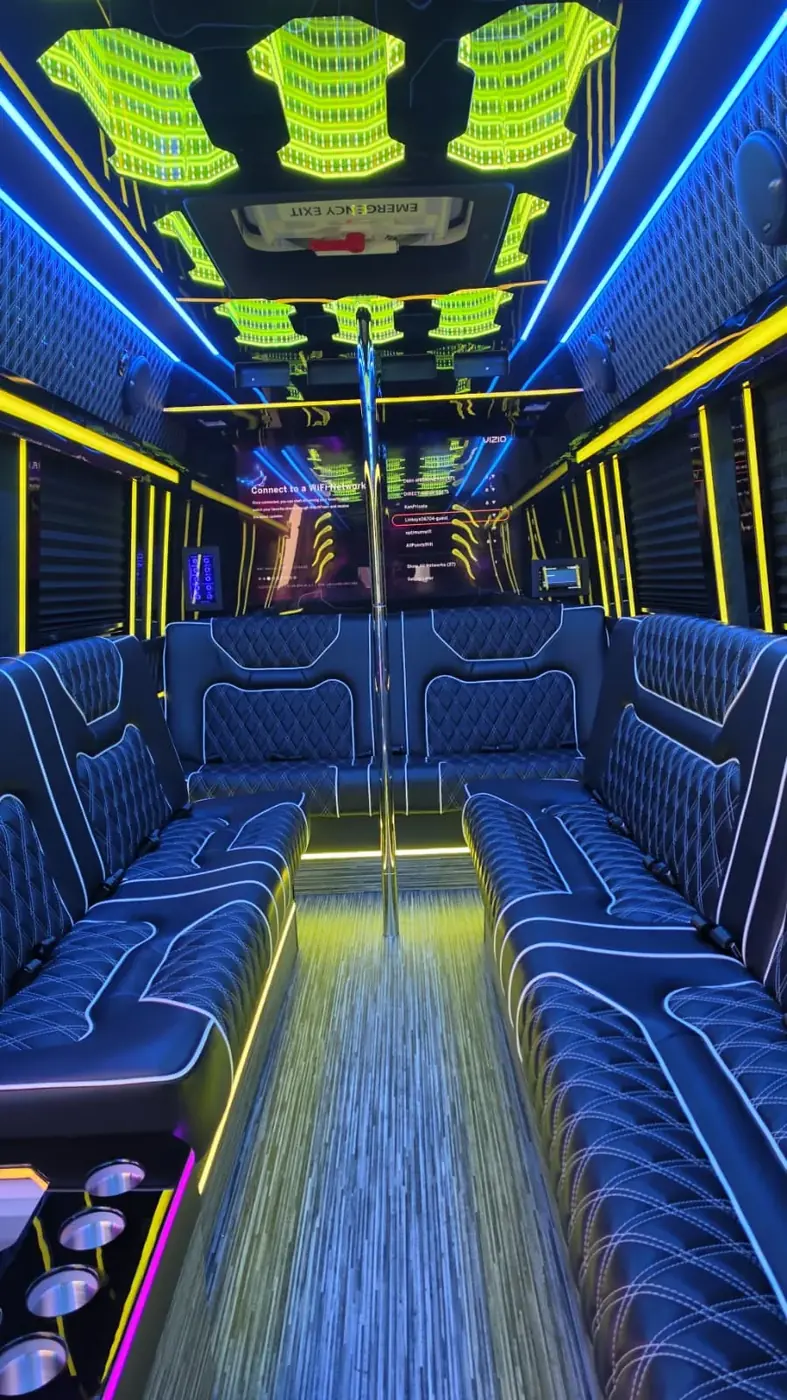 Limo Sprinter lounge seating and aisle beneath blue lighting — Wedding Shuttle Service Long Island: Rental with Driver