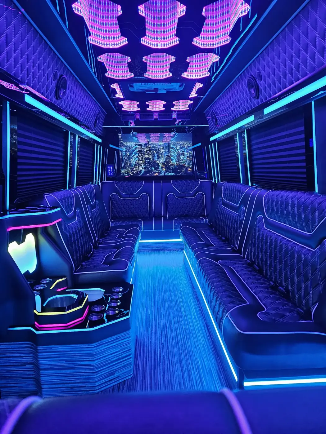 Limo Sprinter lounge seating beneath blue and purple lighting — Party Sprinter Van Rental
