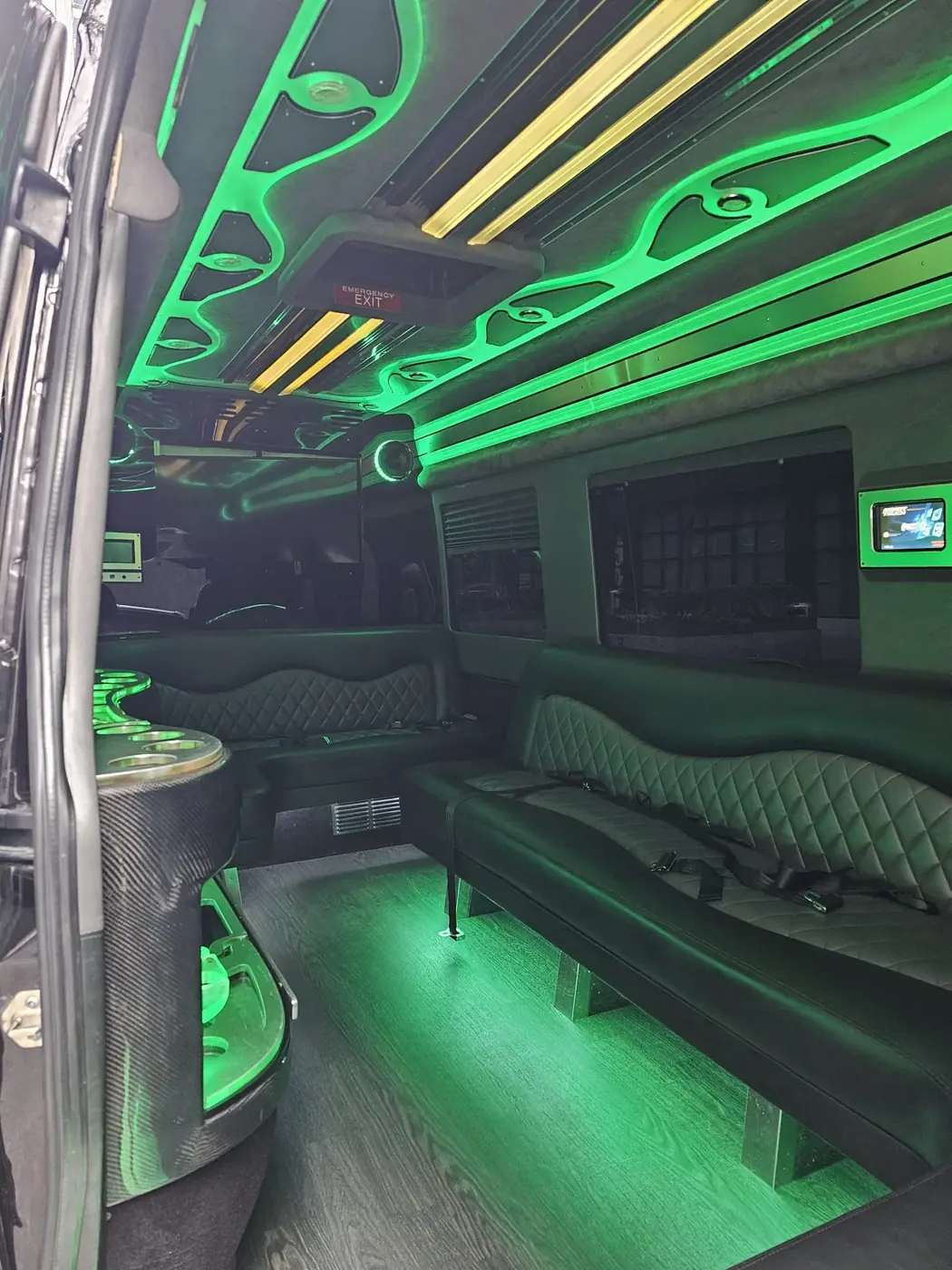 Limo Sprinter bench seating beneath green ceiling lighting — Wedding Sprinter Van Transportation